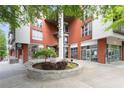 Modern building with 'Lofts' sign and landscaping around the entrance. Retail spaces visible on the ground floor at 245 N N Highland Ne Ave # 220, Atlanta, GA 30307