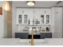 Bright kitchen with white cabinets, stainless steel appliances, and a view of the sink and faucet at 245 N N Highland Ne Ave # 220, Atlanta, GA 30307