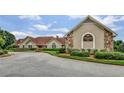 Beautiful Springmonte clubhouse with stone accents and manicured landscaping at 2625 Cross Springs Dr, Cumming, GA 30041