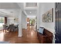 Bright foyer with hardwood floors, elegant trim, and a view into the dining and living areas at 2625 Cross Springs Dr, Cumming, GA 30041