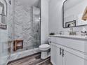 Modern bathroom featuring a glass-enclosed shower with stylish tile and a sleek vanity, offering a spa-like experience at 6380 Cortland Walk, Alpharetta, GA 30005