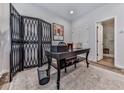 Stylish office space with a modern desk, decorative screen, and ample natural light, ideal for remote work at 6380 Cortland Walk, Alpharetta, GA 30005