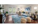 Spacious living room featuring hardwood floors, neutral tones, and lots of natural light at 3701 Essex Ave # 2, Atlanta, GA 30339