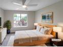 Inviting bedroom with plush carpet, a large window, and neutral decor at 8608 Creekview Ct, Douglasville, GA 30135