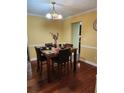 Traditional dining room with wood floors and a table set for four at 645 Birchberry Sw Ter, Atlanta, GA 30331