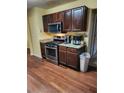 Eat-in kitchen featuring stainless steel appliances and granite countertops at 645 Birchberry Sw Ter, Atlanta, GA 30331
