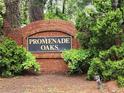Promenade Oaks community sign with lush greenery and professional landscaping at 645 Birchberry Sw Ter, Atlanta, GA 30331