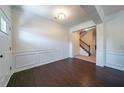 Elegant entryway featuring hardwood floors, decorative moldings, and a view of the staircase at 10 Edgewater Ct, Covington, GA 30016