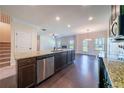 Modern kitchen with granite countertops, stainless steel appliances, and an open layout at 10 Edgewater Ct, Covington, GA 30016