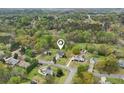 Aerial view of the property surrounded by lush greenery in a quiet, residential neighborhood at 106 Thornwood Dr, Woodstock, GA 30188