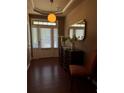Welcoming entryway features a decorative table, mirror, and a glass-paneled front door and transom window at 3627 Mcclaren Way, Lawrenceville, GA 30044