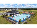 Community pool with ample seating offers residents a refreshing escape and active playground for active families at 166 Aster Avenue, Locust Grove, GA 30248