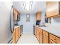 Efficient kitchen design featuring stainless steel appliances, light wood cabinetry, and streamlined countertops at 3665 Essex Ave # 28, Atlanta, GA 30339