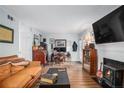 Bright living room featuring hardwood floors, fireplace, and ample seating at 3665 Essex Ave # 28, Atlanta, GA 30339