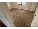 Bedroom with carpet, showing interior door and natural light from the window at 99 Fox Ridge Ct, Dallas, GA 30157