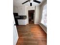 Eat-in kitchen with hardwood floors, ceiling fan and granite countertops at 2533 Whispering Pines Dr, Grayson, GA 30017