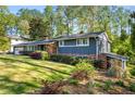 Well-maintained home with brick accents, lush landscaping, and a green lawn at 3325 N Embry Cir, Atlanta, GA 30341