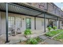 Covered back patio with outdoor seating area and view of landscaped yard at 3085 Colonial Way # L, Atlanta, GA 30341