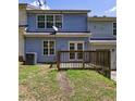 Backyard view with a small wooden deck, some grass, and an air conditioning unit at 6340 Hickory Lane Cir, Union City, GA 30291