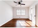 Bright bedroom with hardwood floors, ceiling fan, and plenty of natural light from the window at 3036 Crabapple Cir, Decatur, GA 30034