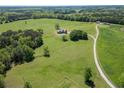 Beautiful aerial view showcasing the house on a vast, green, treed lot at 5187 Parkview Rd, Social Circle, GA 30025