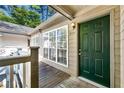 Inviting front entrance featuring a vibrant green door and natural light at 610 Mill Pond Se Dr, Smyrna, GA 30082