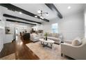 Bright, open-concept living room featuring dark wood floors, white walls, and modern furnishings at 1045 Moreland Se Ave, Atlanta, GA 30316