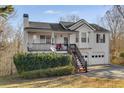 Lovely two-story home with covered porch, staircase, and well-maintained landscaping at 674 Fairview Dr, Dallas, GA 30157