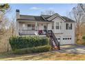 Lovely two-story home with a front porch and two-car garage, complemented by a well-kept yard at 674 Fairview Dr, Dallas, GA 30157
