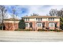 Attractive townhome with brick accents, white trim, and neat landscaping along a quiet street at 7 Chief Matthews Rd # 2A, Decatur, GA 30030