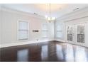 Bright living room with hardwood floors, large windows, and a door to a balcony at 745 Fountainhead Ne Ln # 112, Atlanta, GA 30324