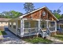 Quaint home showcasing a covered front porch and meticulously kept lawn at 2264 Pryor Rd, Atlanta, GA 30315