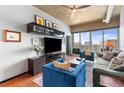 Stylish living room with a large television, comfortable seating, and city views at 943 Peachtree Ne St # 1910, Atlanta, GA 30309