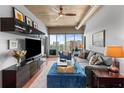 Inviting living room with modern decor, floor to ceiling windows, and city views at 943 Peachtree Ne St # 1910, Atlanta, GA 30309