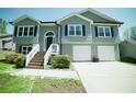 Inviting two-story home with a neatly maintained yard and a two-car garage at 660 Allens Landing Dr, Lawrenceville, GA 30045