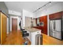 Modern kitchen with stainless steel appliances, granite countertops, and seating at the bar at 130 Arizona Ne Ave # 214, Atlanta, GA 30307