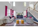 Bright, open living room with tall ceilings, large windows, hardwood floors, and stylish decor at 1549 Tappahannock Trl, Marietta, GA 30062