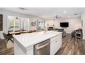 Bright, open-concept kitchen with stainless steel appliances and a large central island overlooking living space at 214 Gaston Ct, Canton, GA 30115