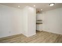 Bright dining area showcasing modern floors, fresh paint, and easy access to the kitchen at 2437 Clarissa Nw Dr, Atlanta, GA 30318