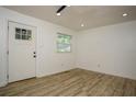 Bright, airy living room features modern flooring, fresh paint, and ample natural light at 2437 Clarissa Nw Dr, Atlanta, GA 30318