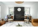 Cozy living room showcasing a brick fireplace and modern accents, perfect for relaxation at 1477 Brawley Ne Cir, Brookhaven, GA 30319