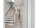 Bright entryway featuring hardwood floors and staircase leading to the upper level at 3988 Centennial Trl, Duluth, GA 30096