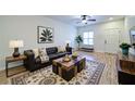 Comfortable living room with stylish furniture, modern decor, and hardwood flooring at 2162 Spikerush Way, Buford, GA 30519