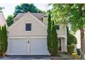 Charming two-story home with a well-maintained front yard and a two-car garage at 3226 Saville Sw St, Atlanta, GA 30331