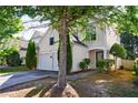 Charming two-story home with a well-maintained front yard and a two-car garage at 3226 Saville Sw St, Atlanta, GA 30331