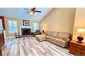 Spacious living room with vaulted ceilings, fireplace, and new flooring at 223 Cheatham Rd, Acworth, GA 30101