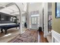 Elegant foyer featuring soaring ceilings, hardwood floors, and direct access to dining and recreational rooms, ideal for entertaining at 2745 Veltre Sw Ter, Atlanta, GA 30311