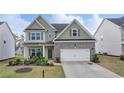 Charming two-story home boasts a brick and siding facade, well-manicured lawn, and inviting curb appeal at 4650 Sandy Creek Dr, Cumming, GA 30028