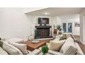 Bright living room featuring a modern fireplace, comfortable seating, and stylish decor at 1209 Brookhaven Woods Ne Ct, Brookhaven, GA 30319
