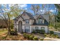 Elegant two-story home with a neutral color scheme and meticulously landscaped front yard at 3139 Players Dr, Jonesboro, GA 30236